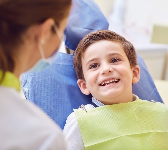 Young boy smiling in pediatric dental office