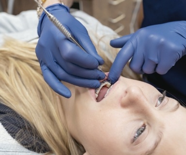 Pediatric dentist examining a child's mouth