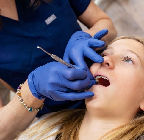 Doctor Tremblay treating a child dental patient