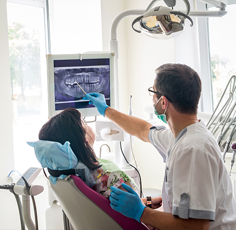 Dentist showing a patient their dental x rays