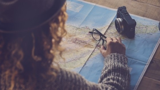 Person looking at a map on a table