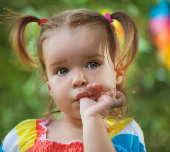 Toddler sucking their thumb