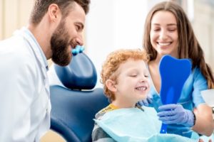 Happy young boy in dentist’s chair