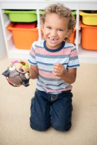 Young boy with missing front tooth